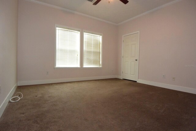 carpeted spare room with ceiling fan and ornamental molding