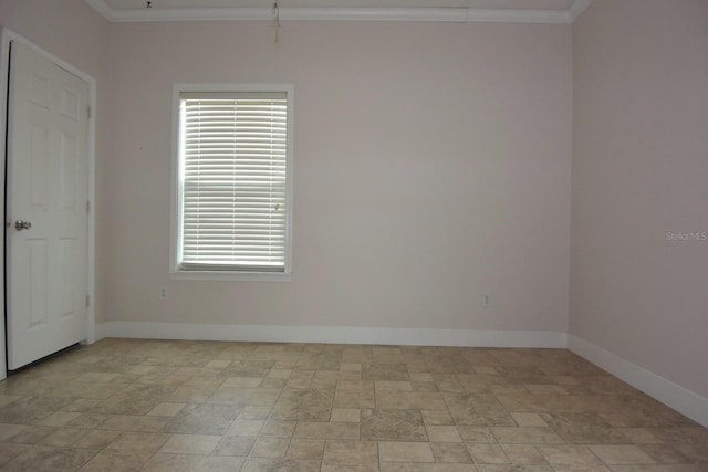 unfurnished room with crown molding