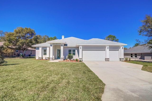 view of front of home with a garage, driveway, a front lawn, and a chimney