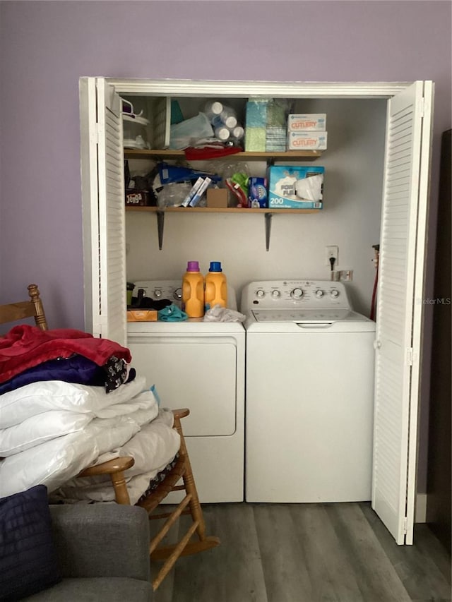 washroom featuring washer and dryer and dark hardwood / wood-style floors