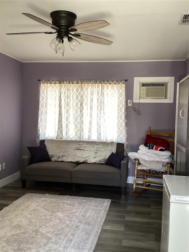 living room featuring a wall mounted air conditioner, dark hardwood / wood-style floors, plenty of natural light, and ceiling fan