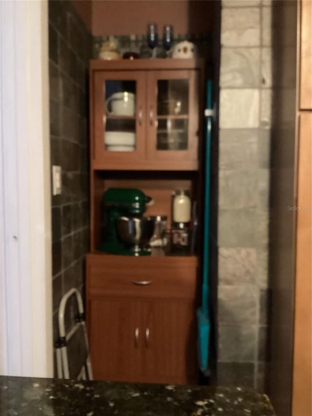 interior space featuring dark stone countertops