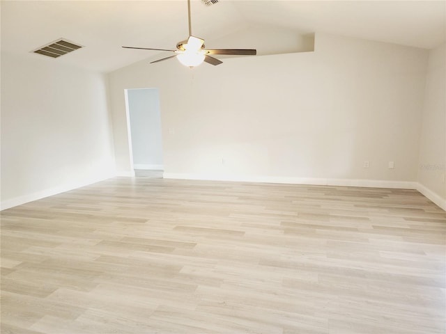 unfurnished room with ceiling fan, light hardwood / wood-style floors, and vaulted ceiling