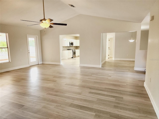 unfurnished living room with ceiling fan, lofted ceiling, and light hardwood / wood-style flooring