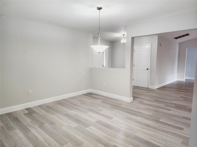 unfurnished room featuring light hardwood / wood-style floors