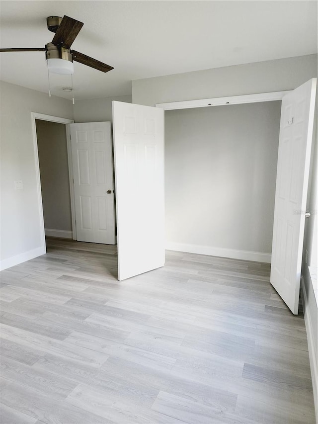 unfurnished bedroom featuring light hardwood / wood-style flooring and ceiling fan