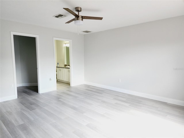 unfurnished room with ceiling fan and light hardwood / wood-style floors