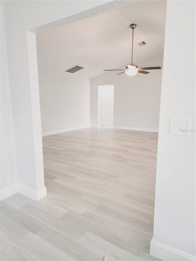 empty room featuring ceiling fan and light wood-type flooring