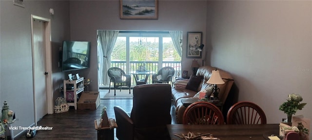 living area with dark hardwood / wood-style flooring