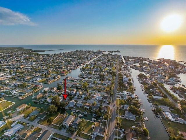 aerial view at dusk with a water view