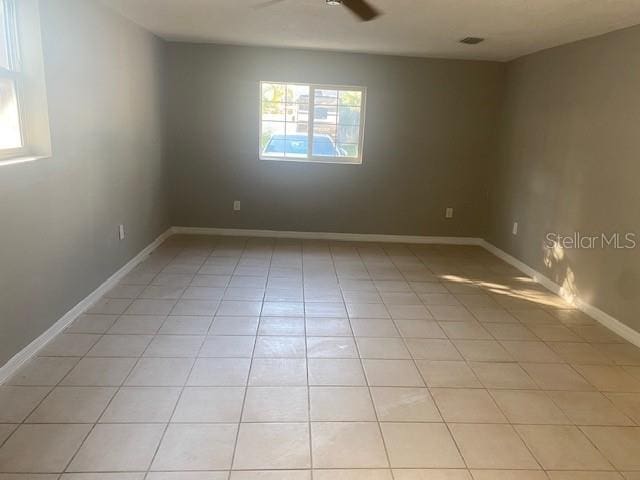 unfurnished room featuring light tile patterned flooring