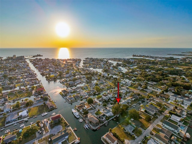 aerial view at dusk with a water view