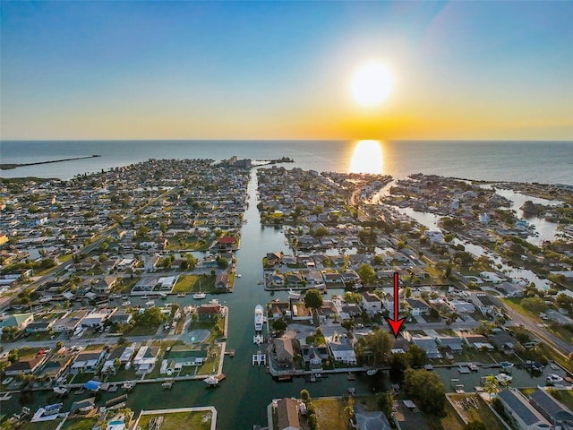 aerial view at dusk with a water view