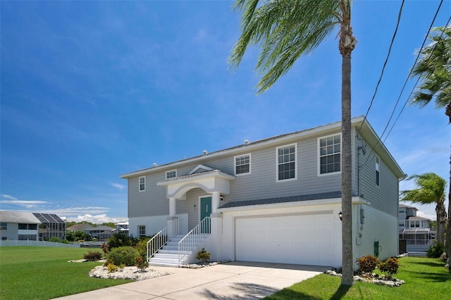 view of front of home featuring a garage and a front yard