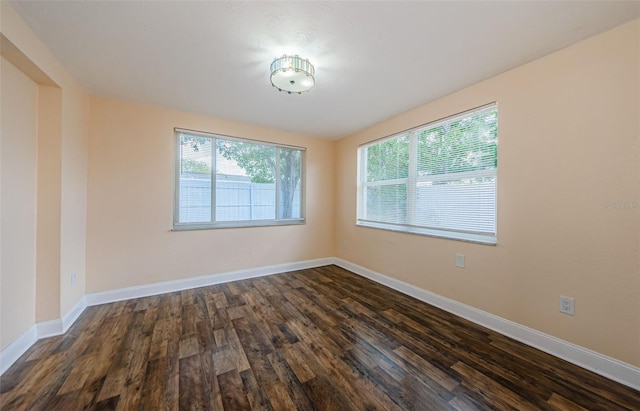 unfurnished room featuring dark hardwood / wood-style floors