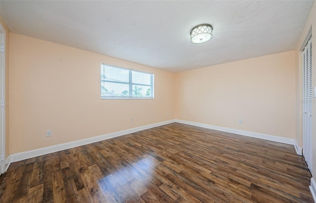 empty room featuring dark hardwood / wood-style floors