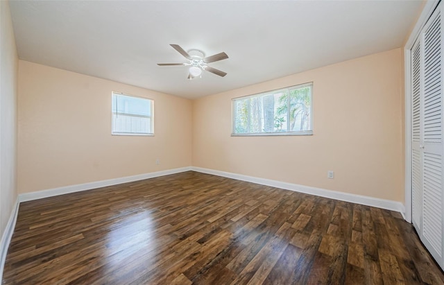 unfurnished bedroom featuring a closet, ceiling fan, and dark hardwood / wood-style floors