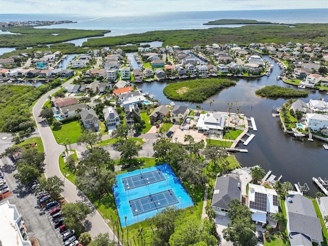 drone / aerial view featuring a water view and a residential view