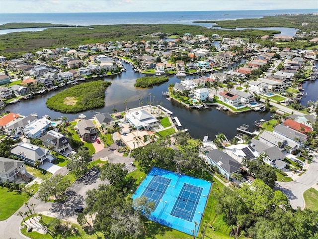 drone / aerial view featuring a water view and a residential view