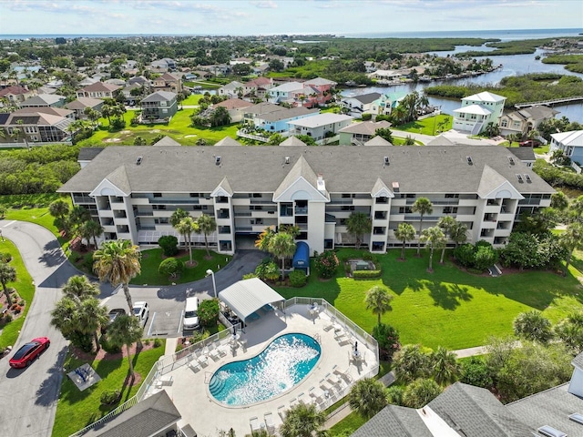 bird's eye view with a water view and a residential view