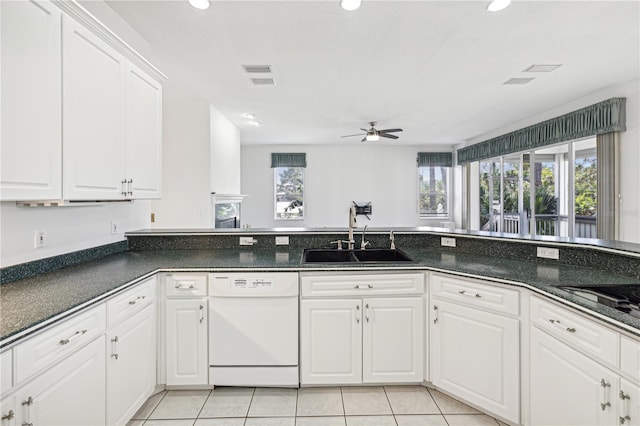 kitchen featuring ceiling fan, sink, light tile patterned floors, dishwasher, and white cabinetry