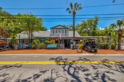 front facade with a carport