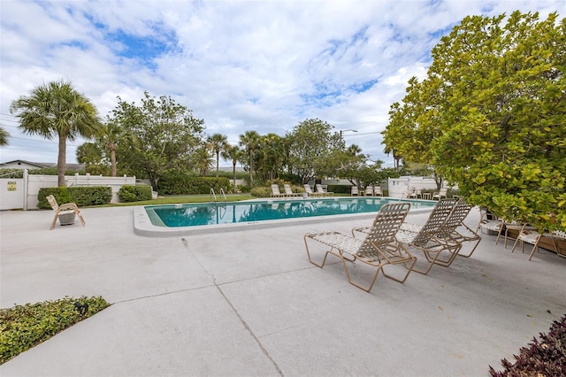 view of swimming pool with a patio area