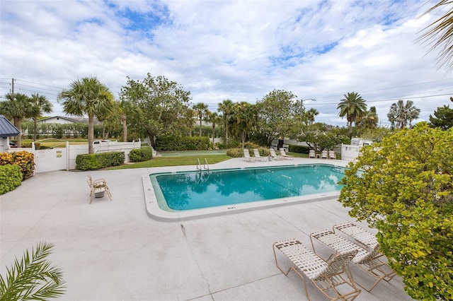 view of swimming pool with a patio area