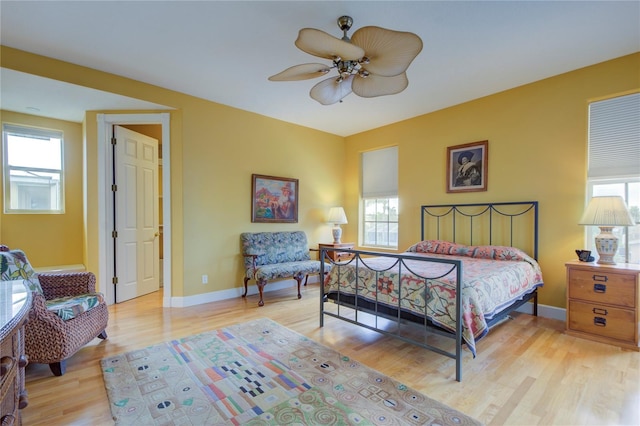 bedroom with ceiling fan and light hardwood / wood-style flooring