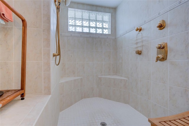 bathroom with tiled shower