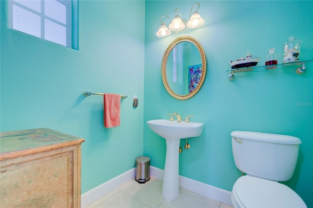 bathroom featuring toilet and tile patterned floors