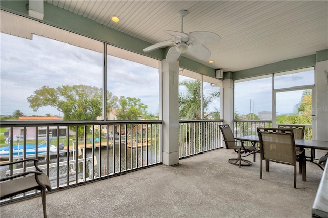 sunroom featuring ceiling fan