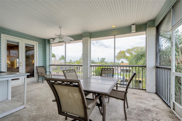 sunroom with ceiling fan and french doors