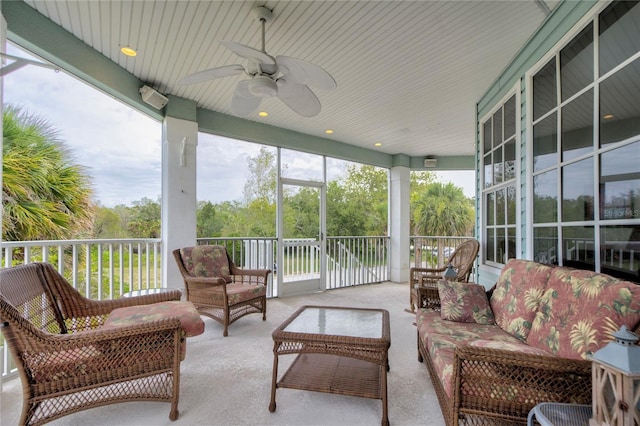 sunroom with ceiling fan and a wealth of natural light