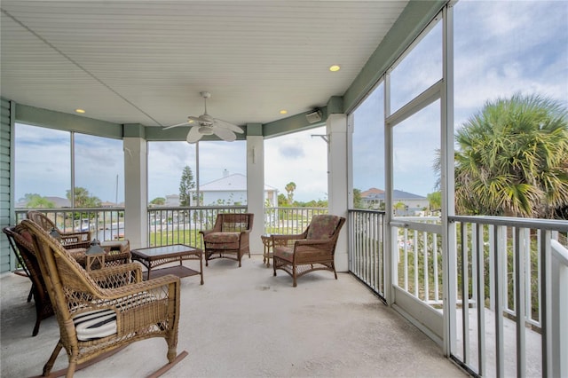 sunroom with ceiling fan