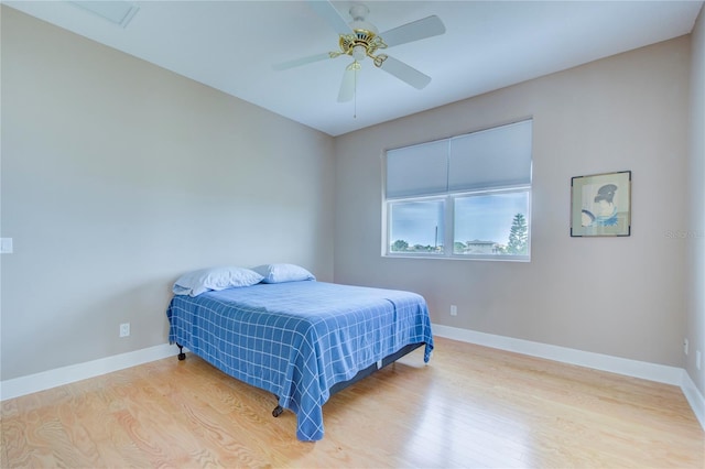 bedroom featuring ceiling fan and hardwood / wood-style flooring