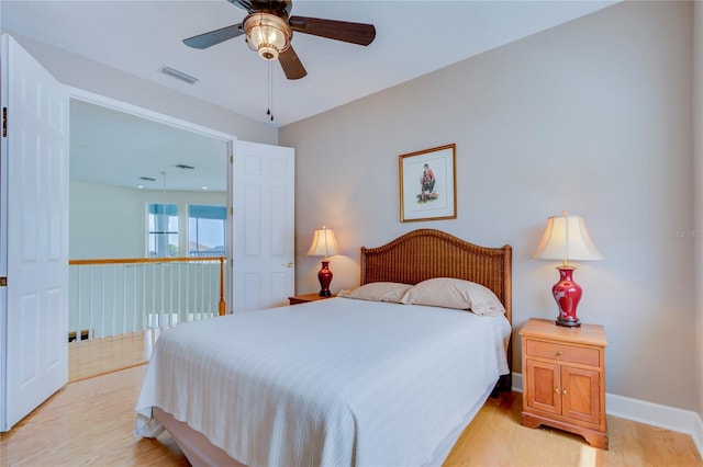 bedroom with ceiling fan and light hardwood / wood-style flooring