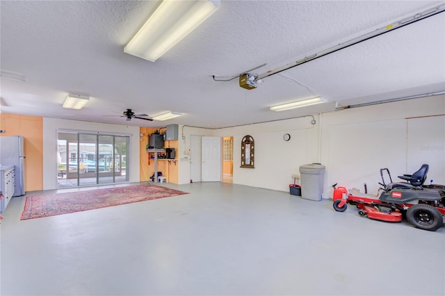 garage with refrigerator and a garage door opener