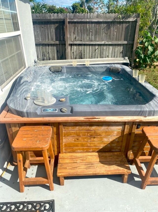 view of pool featuring a hot tub