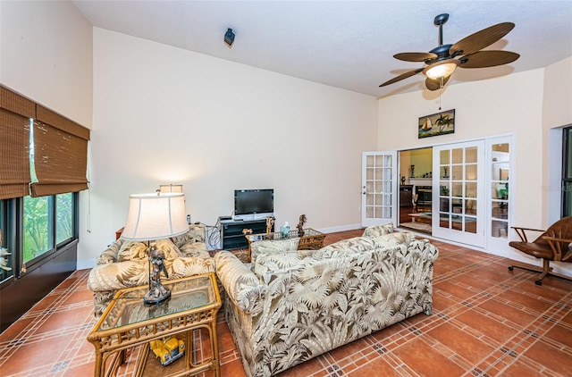 living room with ceiling fan and french doors