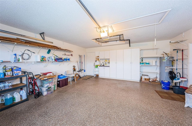 garage with a garage door opener and water heater