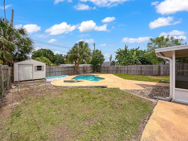 view of yard featuring a patio, a fenced backyard, a fenced in pool, a storage shed, and an outbuilding