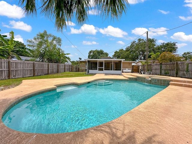 view of swimming pool featuring a patio, a fenced in pool, a fenced backyard, and a sunroom
