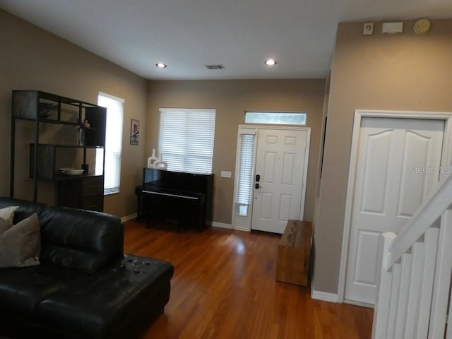 foyer entrance with dark wood-type flooring