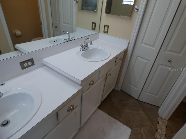 bathroom featuring tile patterned floors and vanity