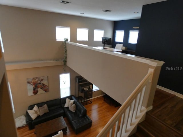 living room with a healthy amount of sunlight and wood-type flooring