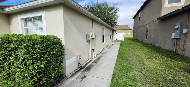 view of home's exterior featuring a lawn