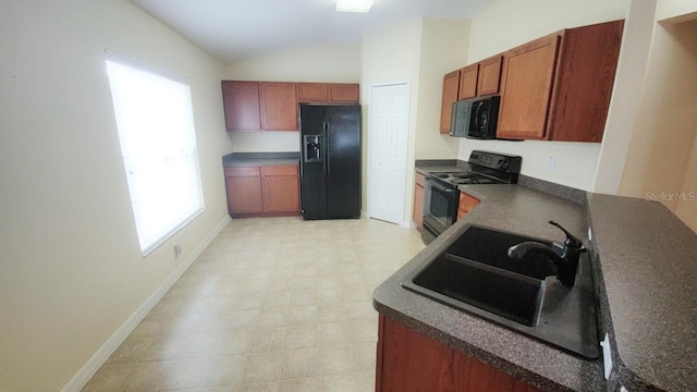 kitchen with sink, vaulted ceiling, and black appliances