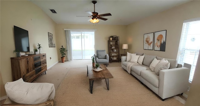 carpeted living room featuring ceiling fan