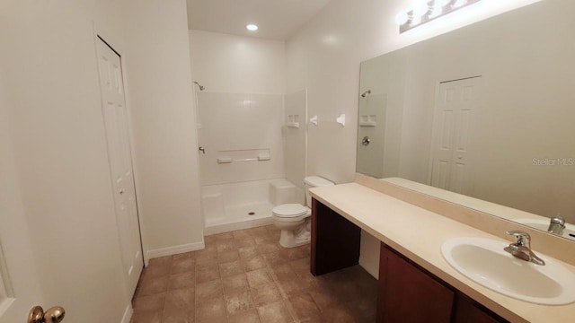 full bath featuring a walk in shower, a closet, vanity, and toilet